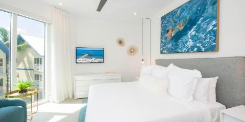The image shows a bright and modern bedroom