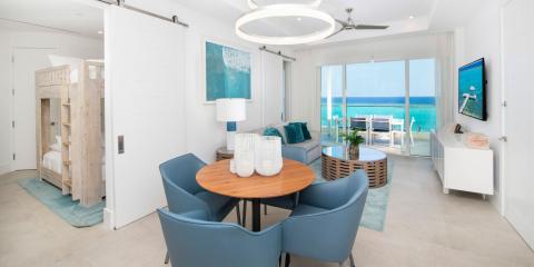 The image shows a modern and stylish interior of a beachfront property