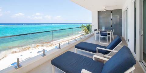 This image captures a beautiful balcony view overlooking a beach scene