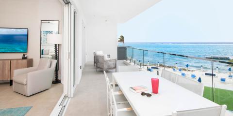 This image features an interior and exterior view of a luxurious seaside setting