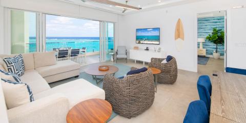 This image shows a modern and stylish beachfront living room