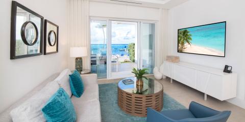 This image shows a modern, beachfront living room