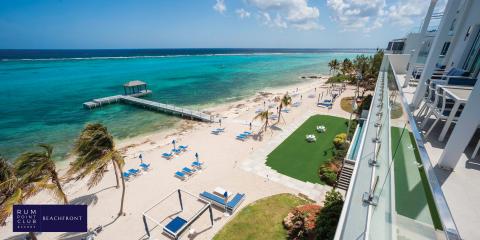 The image shows a beautiful beachfront resort setting