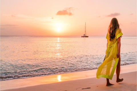 This image captures a serene beach scene at sunset