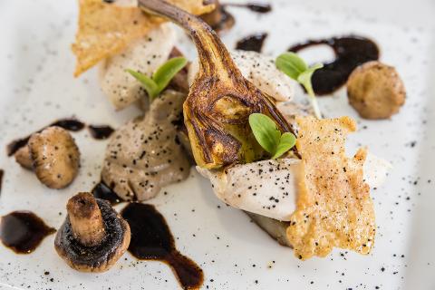 This image features a gourmet dish that includes a variety of components