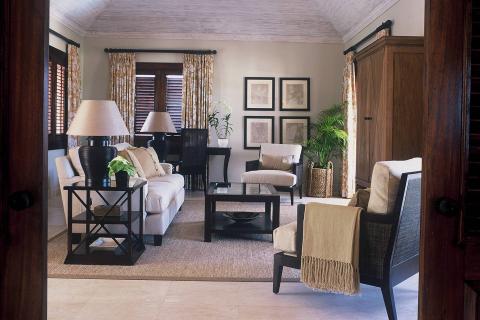 The image shows an elegant living room viewed from an open doorway