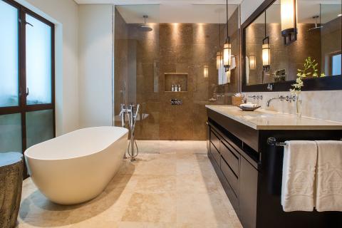 This image shows a luxurious, modern bathroom