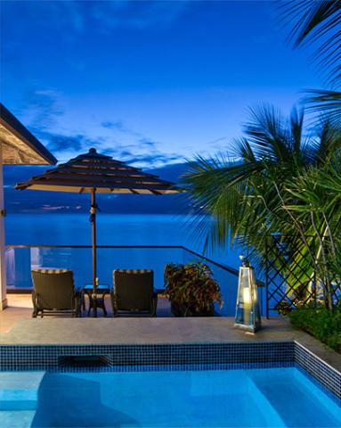 The image shows a picturesque resort scene during twilight