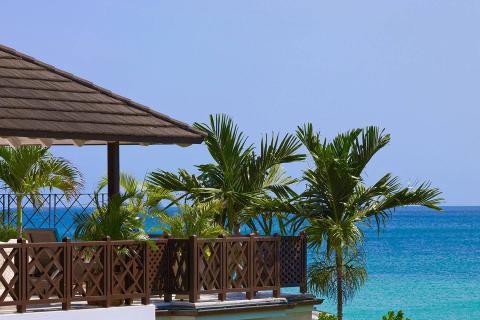 This image features a serene tropical seaside setting