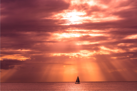 This image captures a beautiful sunset scene over the ocean