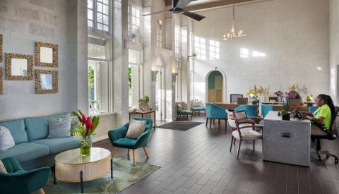 This image shows a spacious and elegantly designed interior that appears to be a lobby or a communal space within a building