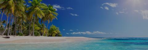This image displays a stunning tropical beach scene