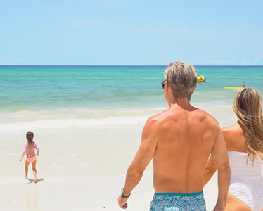 This image shows a family at the beach