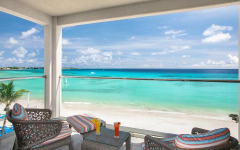 This image shows a beautiful seaside view from a balcony