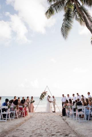 This image shows a beach wedding ceremony