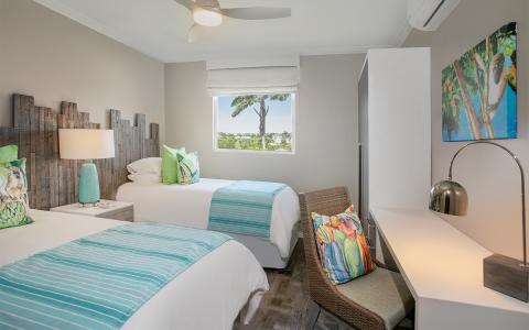 This image shows a modern and neatly decorated bedroom