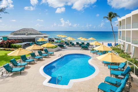 The image features a serene beach resort setting