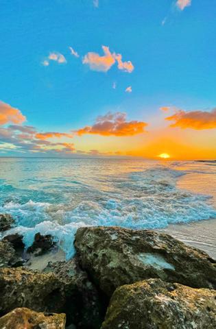 This image captures a beautiful seaside scene at sunset