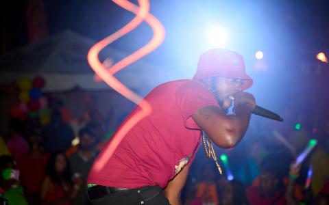 This image captures a dynamic scene at a vibrant outdoor music event or concert