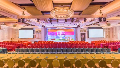 This image shows a large conference hall set up for an event