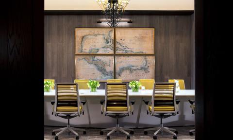The image shows a modern and stylish conference room