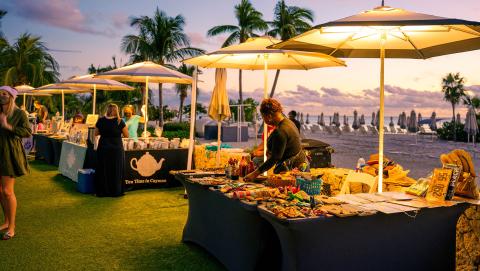This image captures an outdoor market or fair during the evening