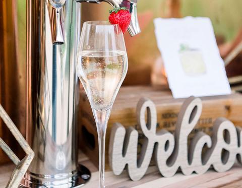 The image features a setting that appears to be part of a welcoming or celebratory event