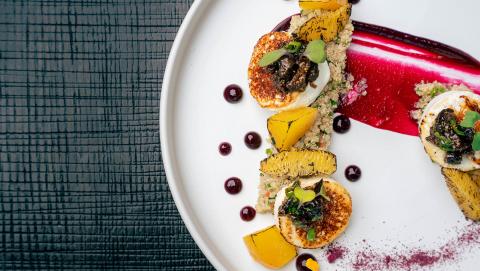 This image features a beautifully presented gourmet dish on a white plate