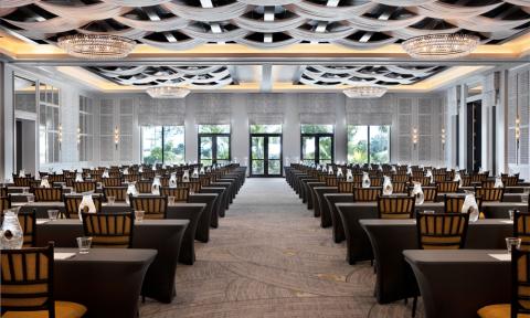 The image shows a large, elegantly designed banquet hall or conference room