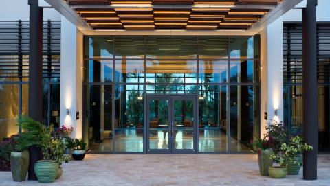 This image shows the front entrance of a modern and elegant building