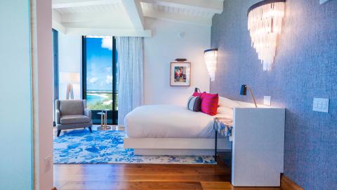 The image shows a stylish and contemporary bedroom