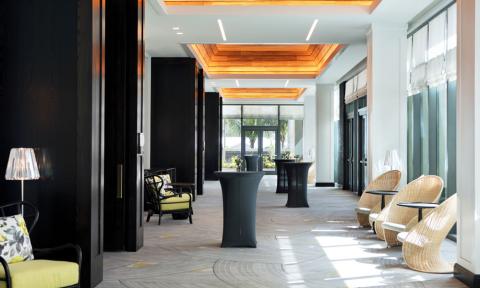 The image shows a modern and stylish indoor lounge or hallway
