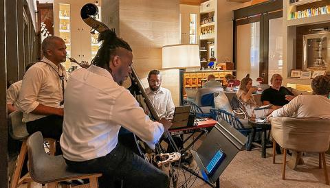 The image shows a live music setup inside what appears to be a cozy and upscale restaurant or lounge