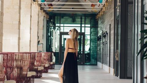 The image displays a stylish modern interior setting, likely a hotel or commercial lobby