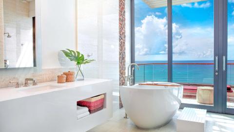 This image depicts a modern bathroom with a luxurious design