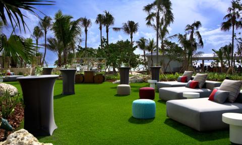 This image shows an outdoor lounge or event space decorated in a modern style