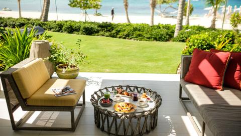 breakfast on bungalow patio by water