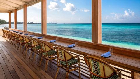 This image shows a serene beachside bar setting