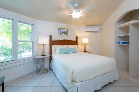 The image shows a bright and inviting bedroom