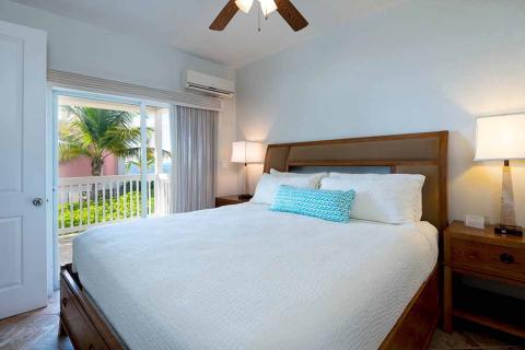 The image shows a bright and well-decorated bedroom