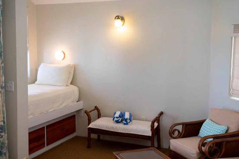 The image shows a neat and simply furnished room