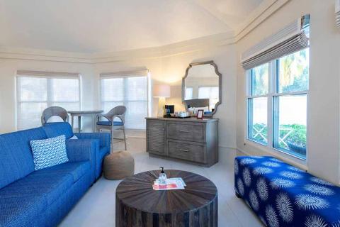 This image features an elegantly styled beach house living room