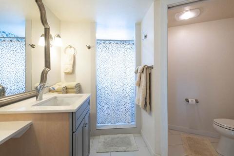 This image shows a modern, well-lit bathroom