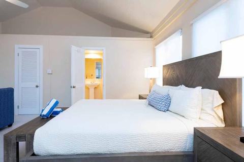 The image shows a neatly arranged bedroom
