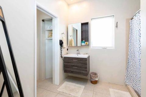 This image features a modern bathroom interior