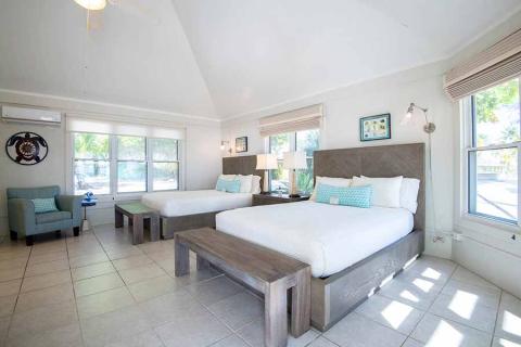 This image shows a bright, well-lit hotel room or a resort room featuring modern decor