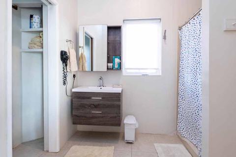 This image shows a neatly organized bathroom