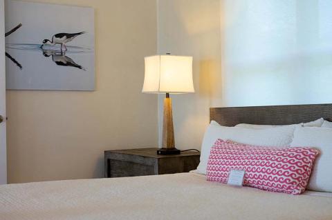 The image shows a neatly arranged bedroom setting