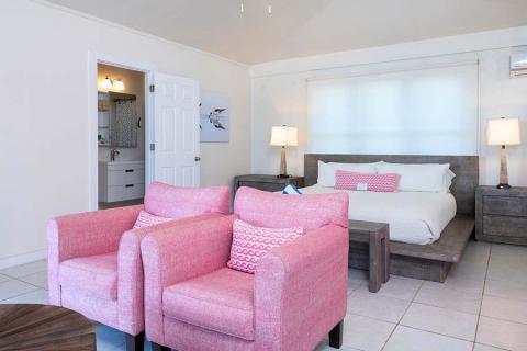The image shows a neatly arranged hotel room or a similar accommodation space