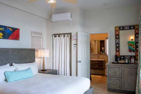 This image shows a well-furnished, modern bedroom